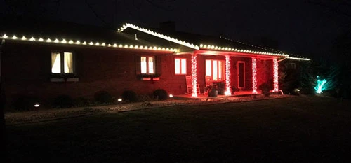 A home decorated with holiday lights in Millstadt, IL.