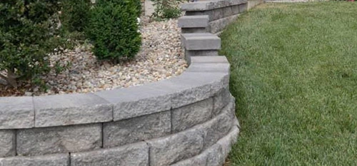 A custom retaining wall and steps installed at a home in Red Bud, IL.
